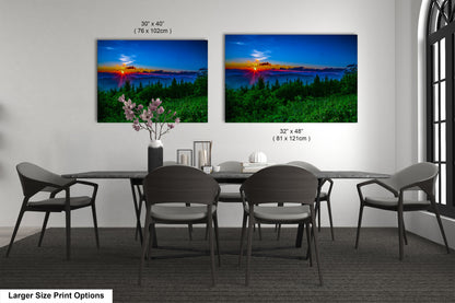 a dining room table with four chairs and a vase of flowers