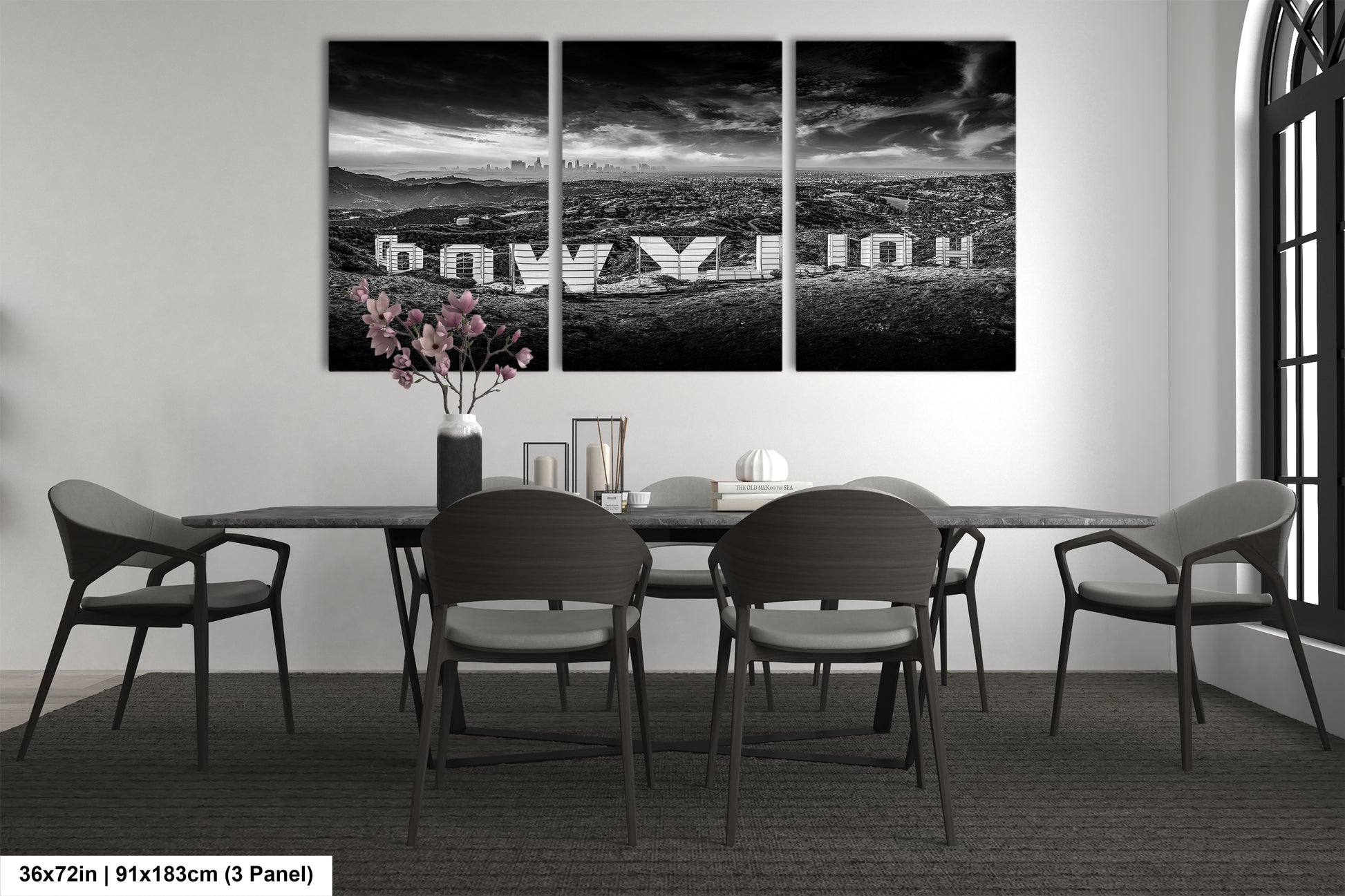 a black and white photo of a dining room table