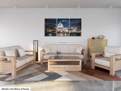 a living room filled with furniture and a painting on the wall