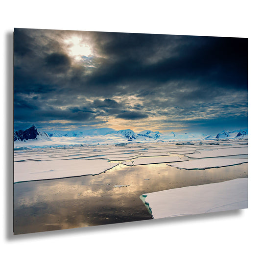 the sun is shining through the clouds over the ice