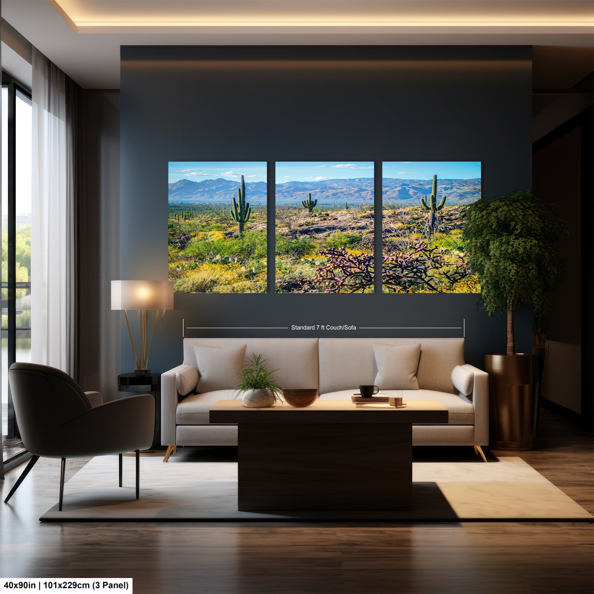 A modern living room with a large wall-mounted painting depicting a desert landscape with cacti and flowers. The painting is framed in a standard 7' x 10' CouchCoat.