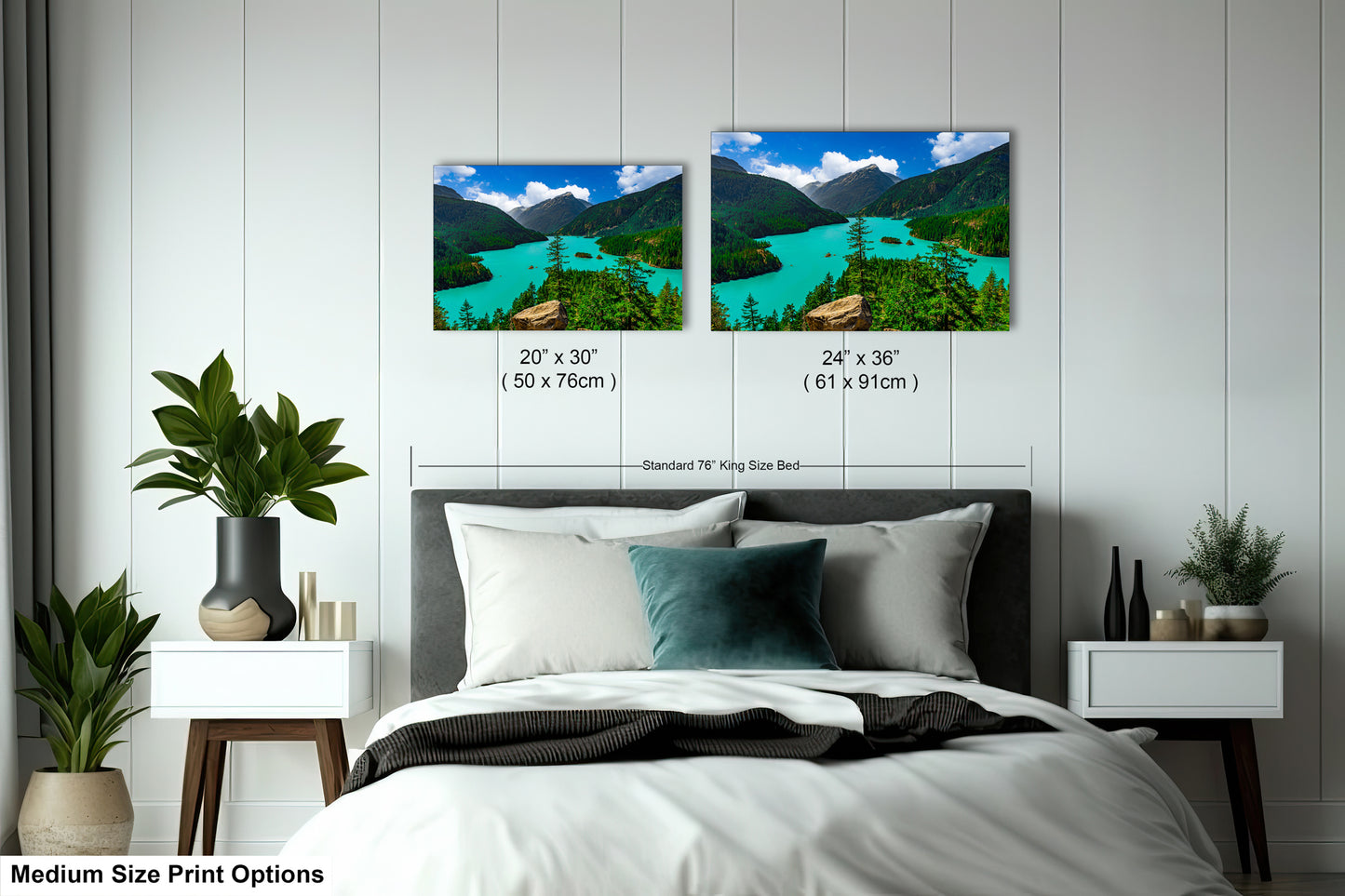 a bedroom with a bed, nightstands, and potted plants. There are two framed landscape photographs hanging on the wall above the bed, depicting a scenic mountain view with turquoise water.