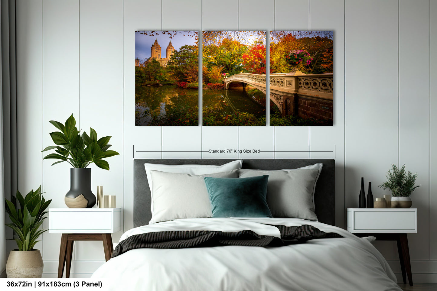 A bedroom with a large bed, nightstands, and a painting of a scenic bridge and trees hanging on the wall.