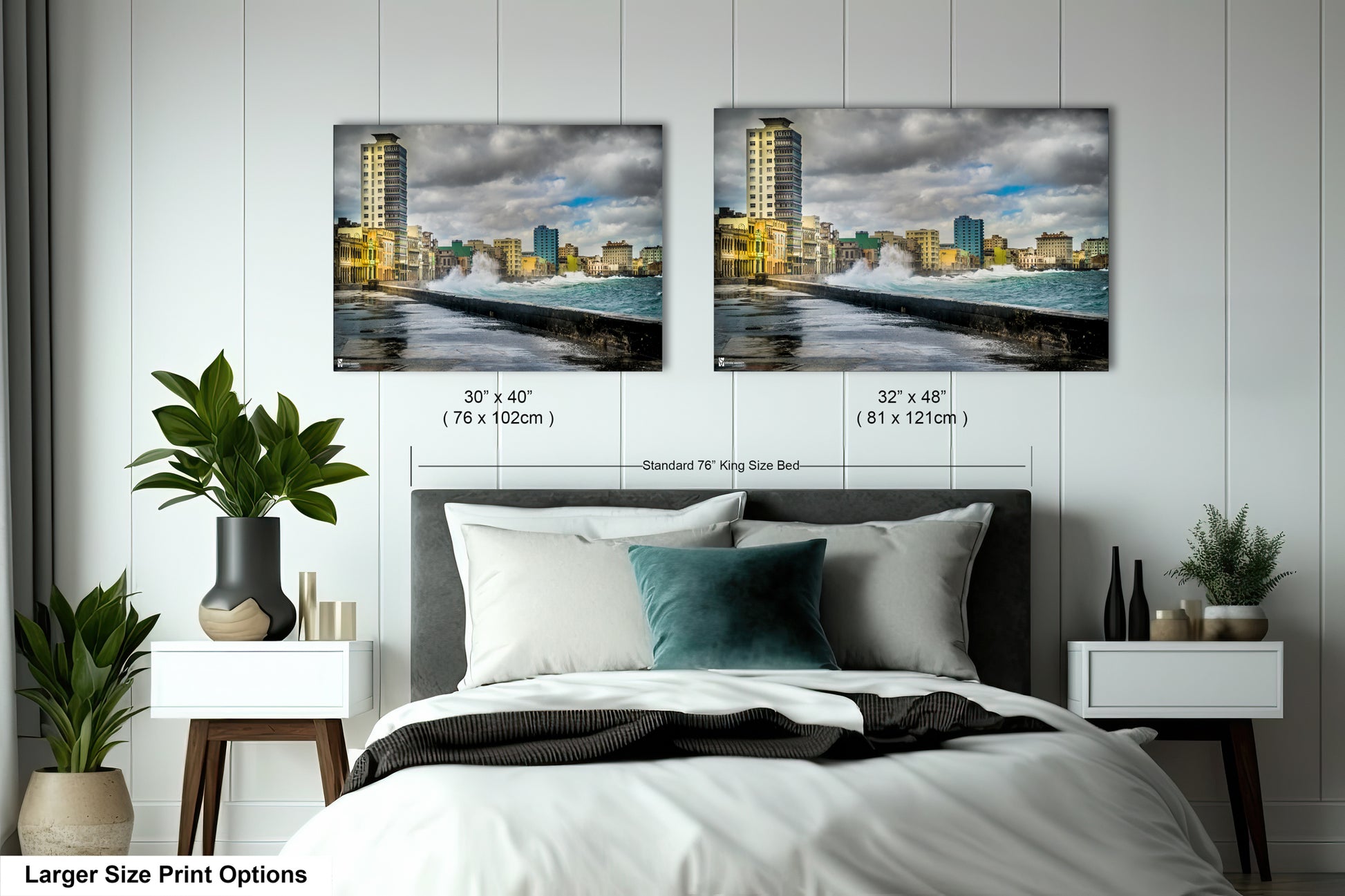 a bedroom with a bed and two pictures on the wall