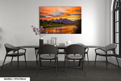 a dining room table with chairs and a painting on the wall