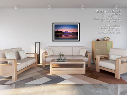 a living room filled with furniture and a painting on the wall