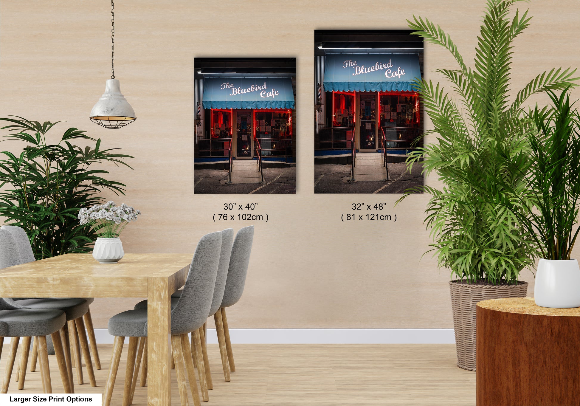 a dining room with a table and chairs next to a potted plant
