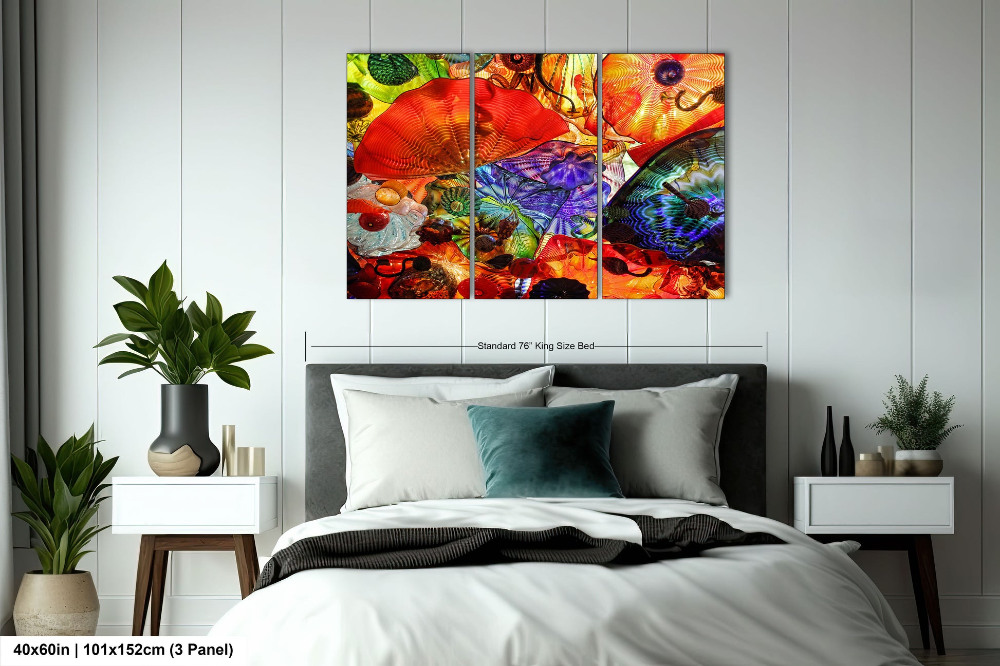 a bed room with a neatly made bed and a painting on the wall