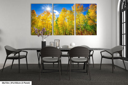 a dining room table with four chairs and a painting on the wall