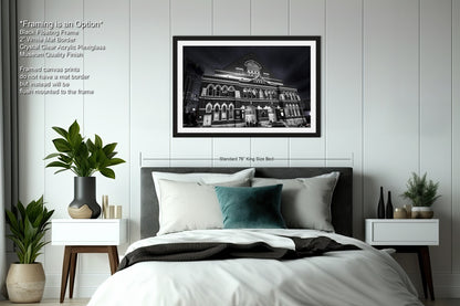 a black and white photo of a hotel room