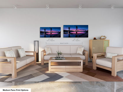 a living room filled with furniture and a painting on the wall