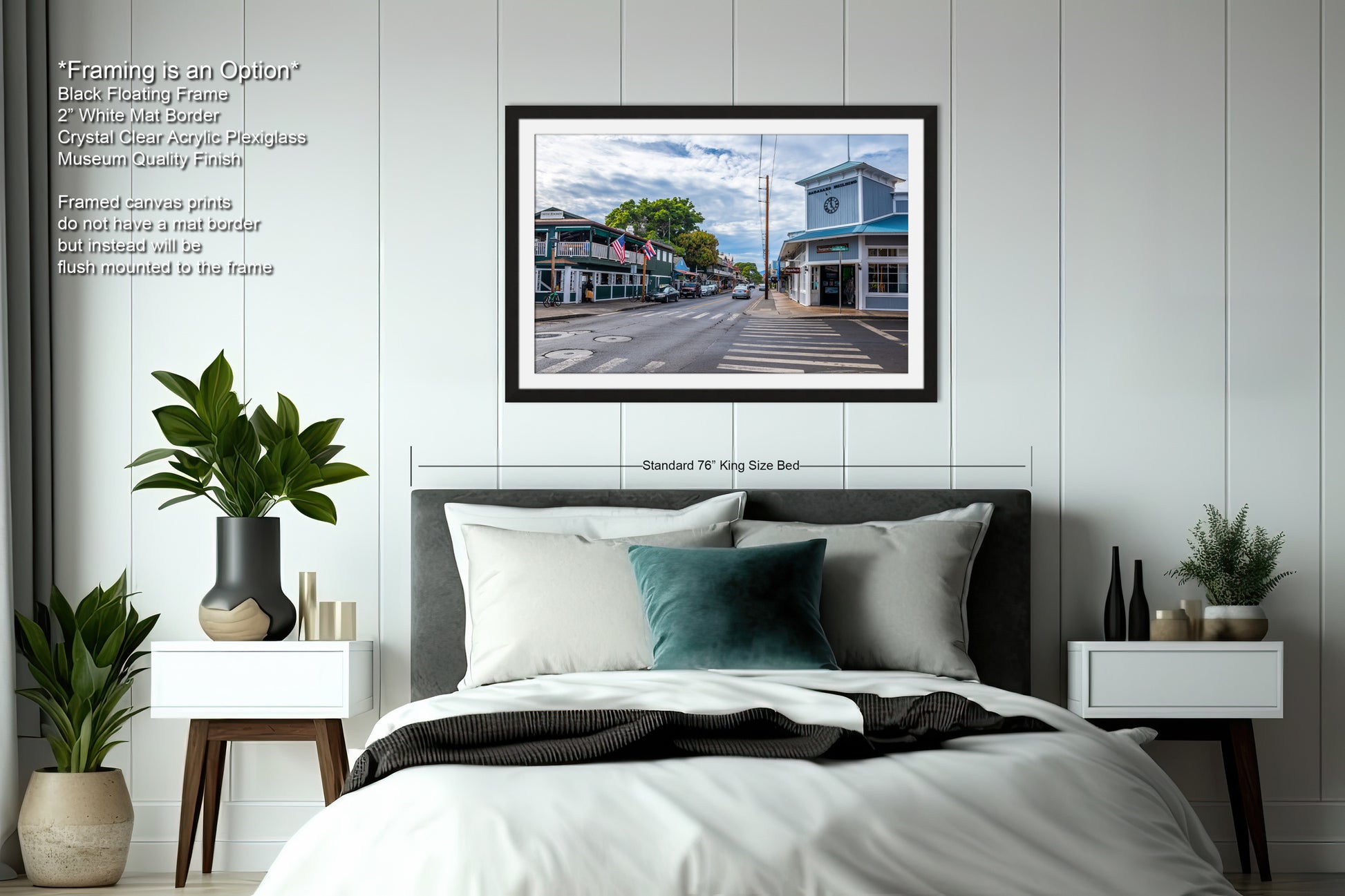 a bedroom with a bed and a picture hanging on the wall