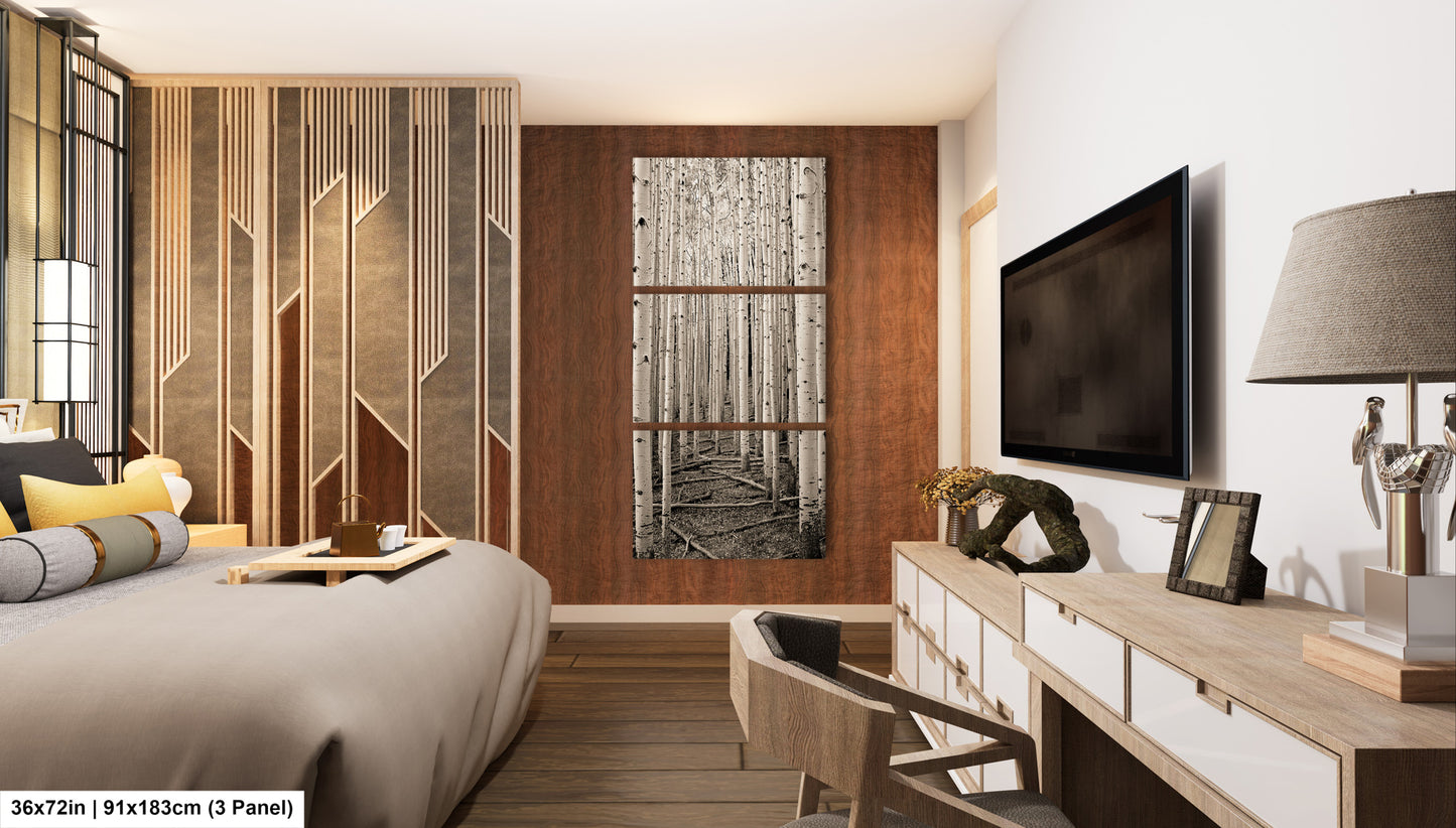 a bed room with a neatly made bed and a flat screen tv