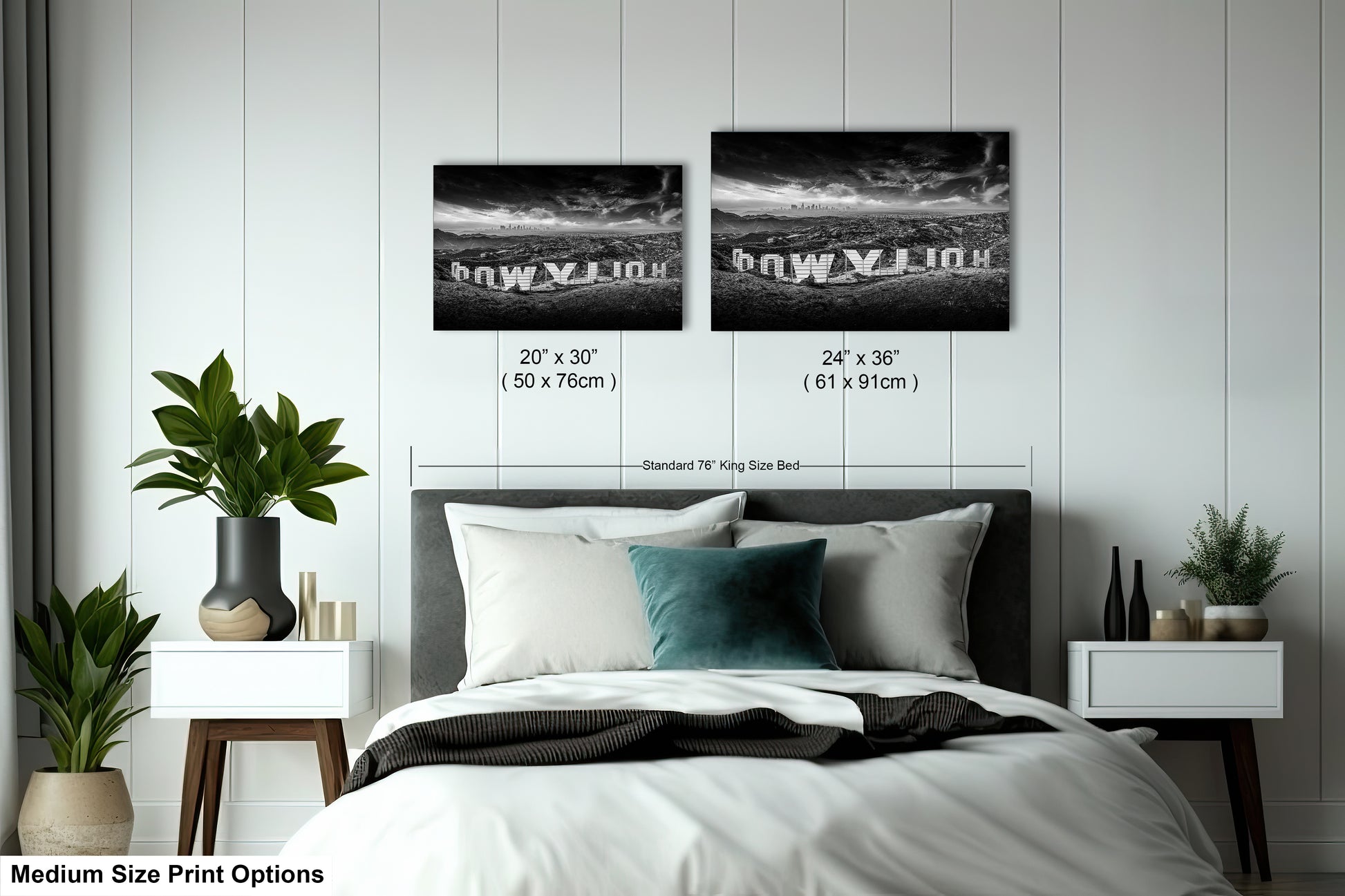 a bedroom with a bed and two pictures on the wall