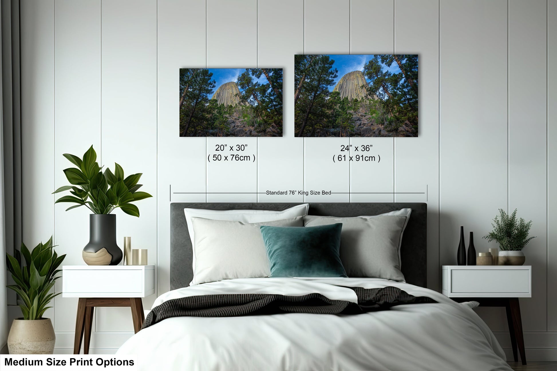 a bedroom with a bed and two pictures on the wall
