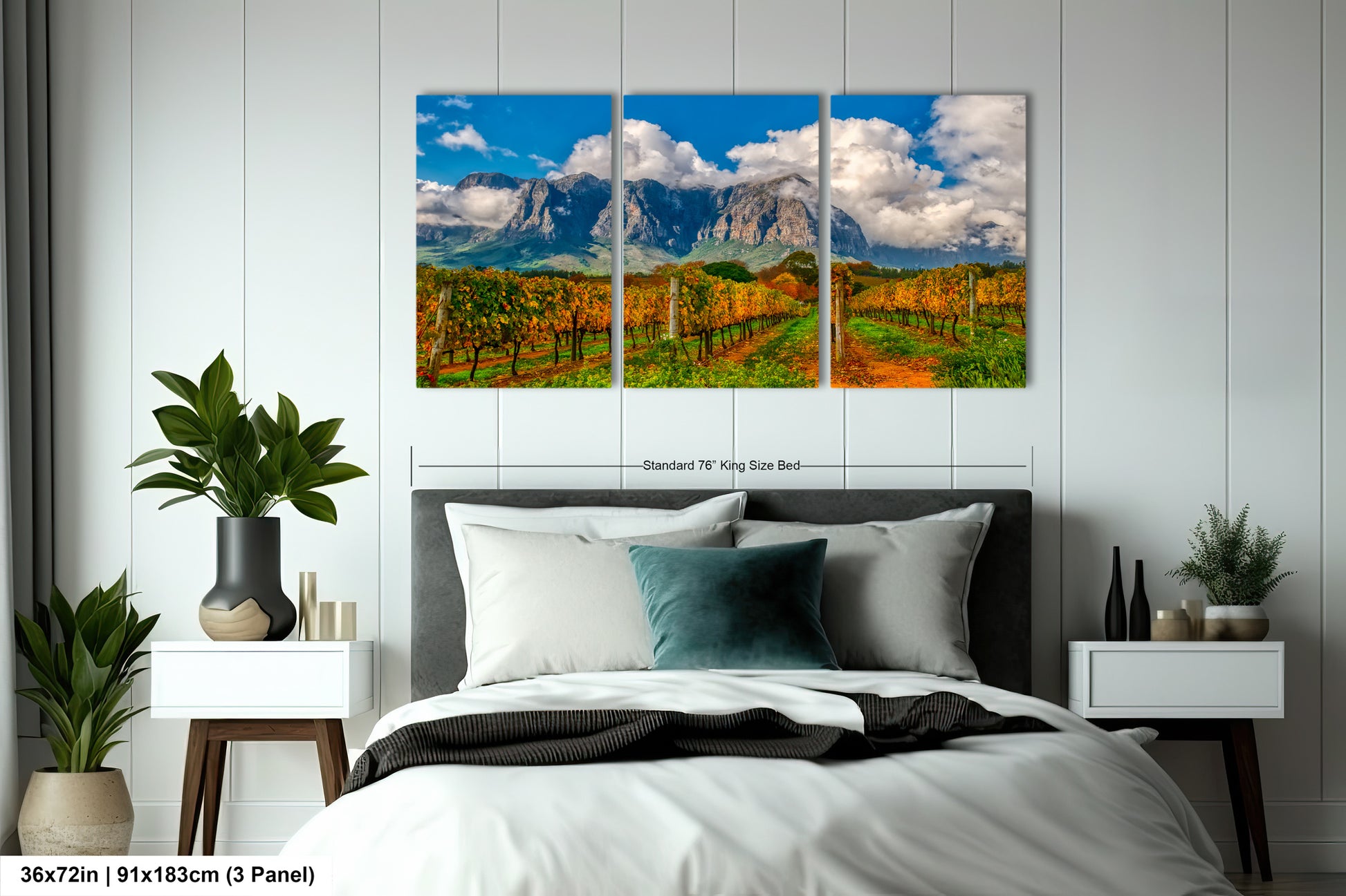 a bed room with a neatly made bed and paintings on the wall