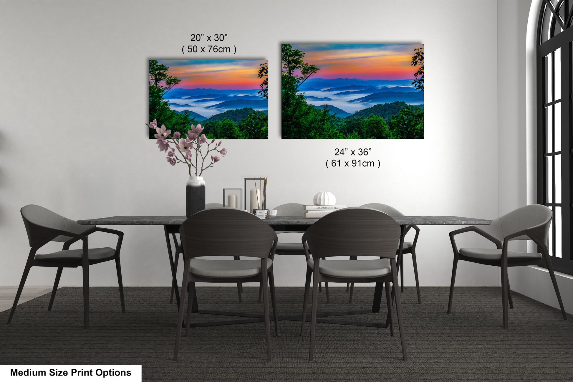 a dining table with four chairs and a vase of flowers