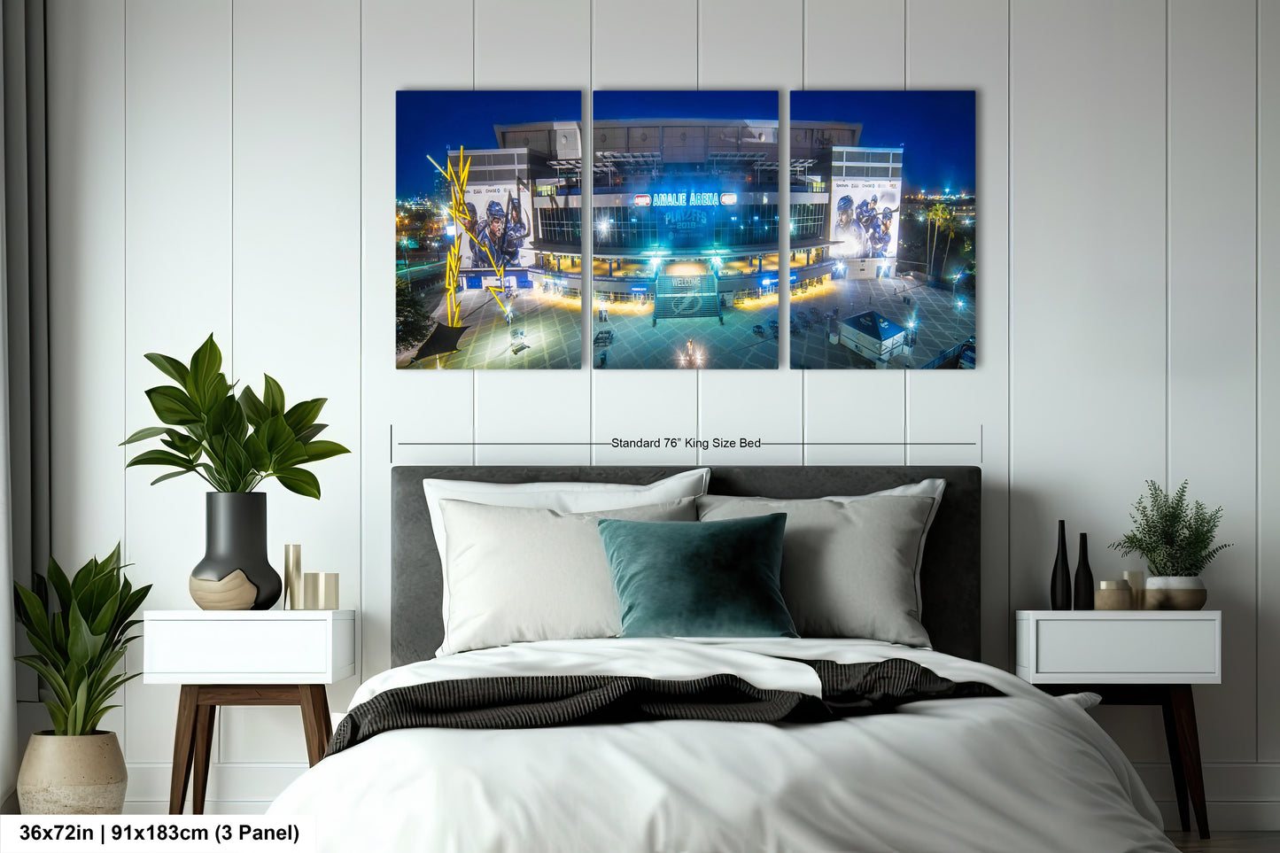 a bed room with a neatly made bed and two paintings on the wall