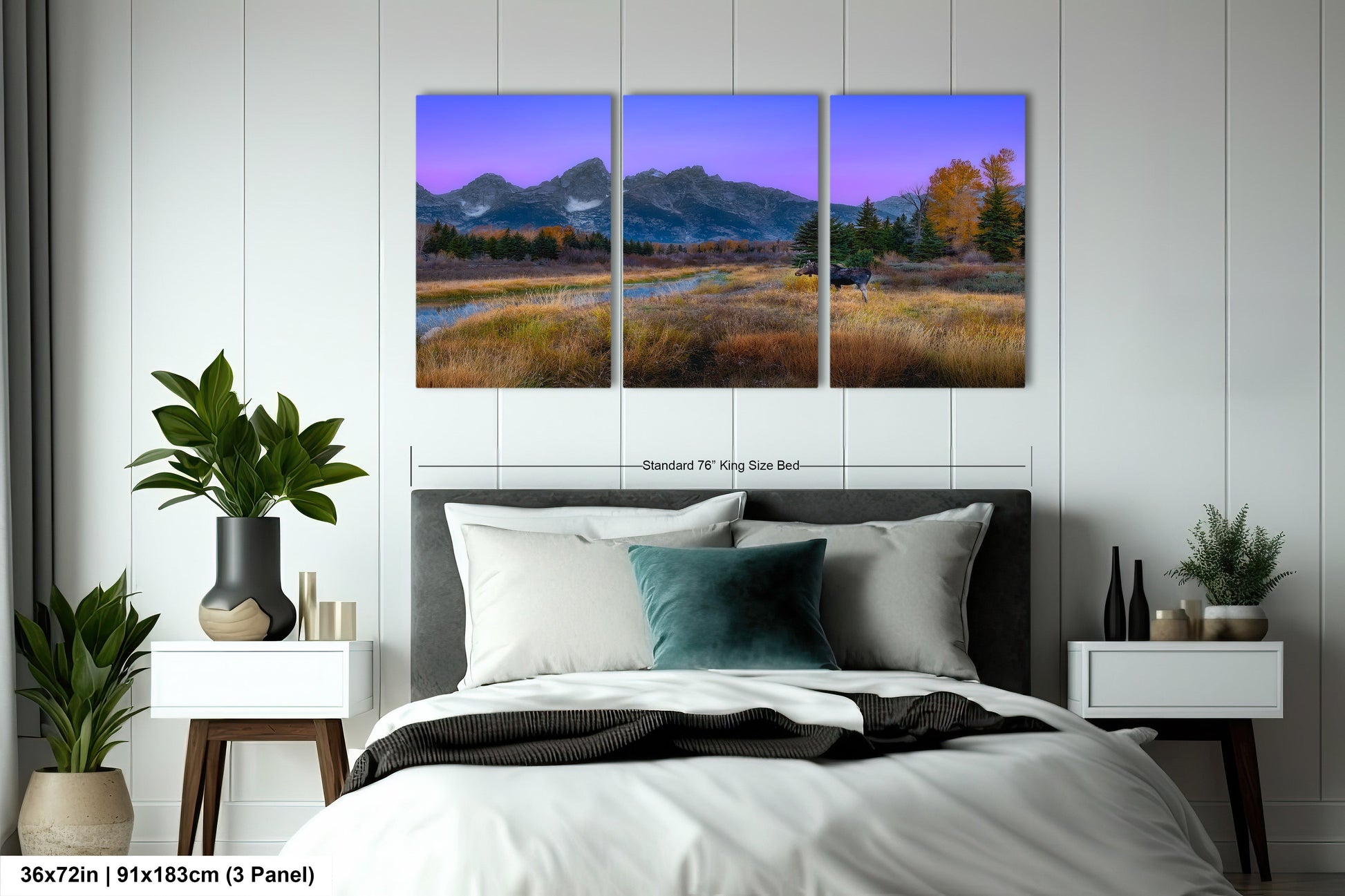 a bedroom with a bed and two paintings on the wall