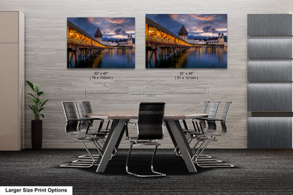a dining room table with chairs in front of two pictures of a bridge