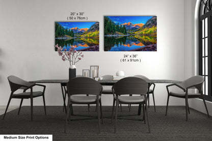 a dining room table with four chairs and a painting on the wall