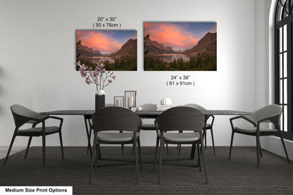 a dining room table with chairs and a vase with flowers