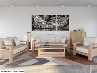 a living room filled with furniture and a painting on the wall