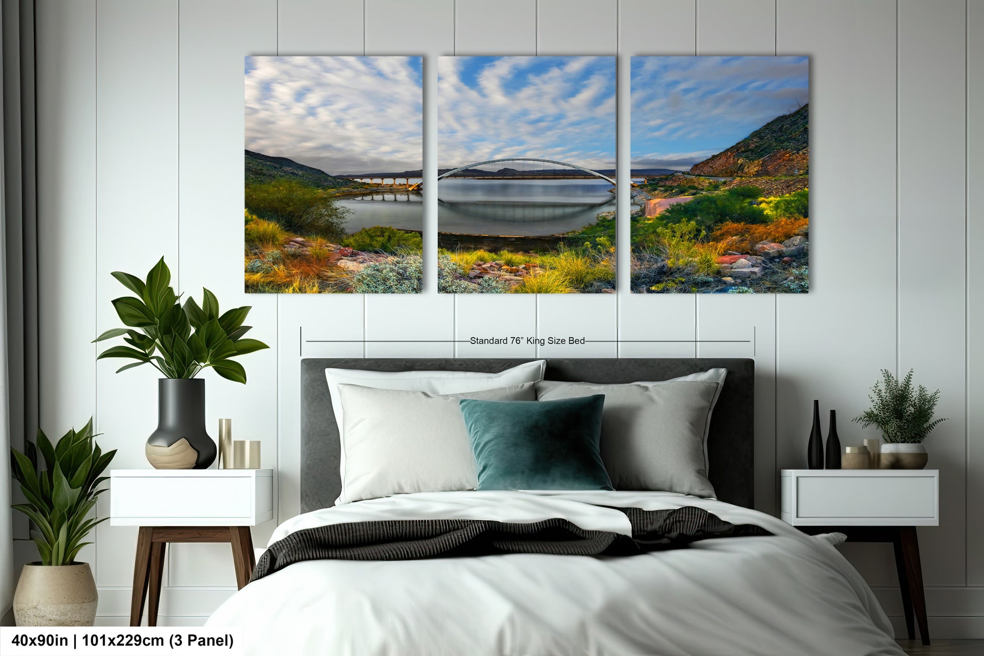 a bed room with a neatly made bed and two paintings on the wall