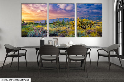 a dining room table with chairs and a painting on the wall