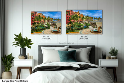a bedroom with a bed and two pictures on the wall