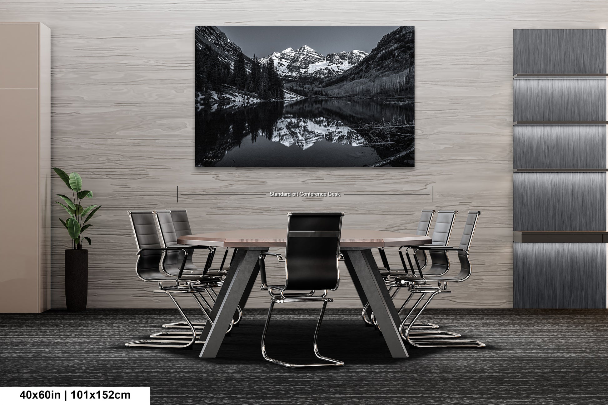 a black and white photo of a table and chairs