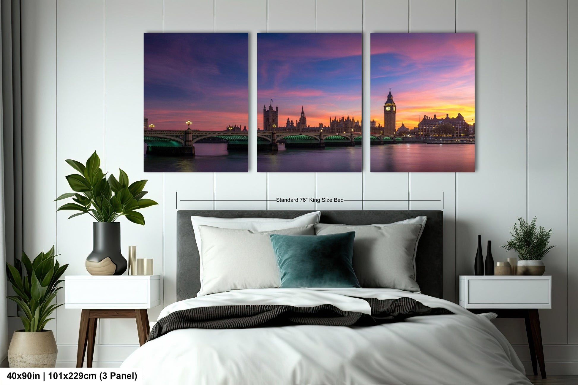 a bedroom with a large bed and three paintings on the wall