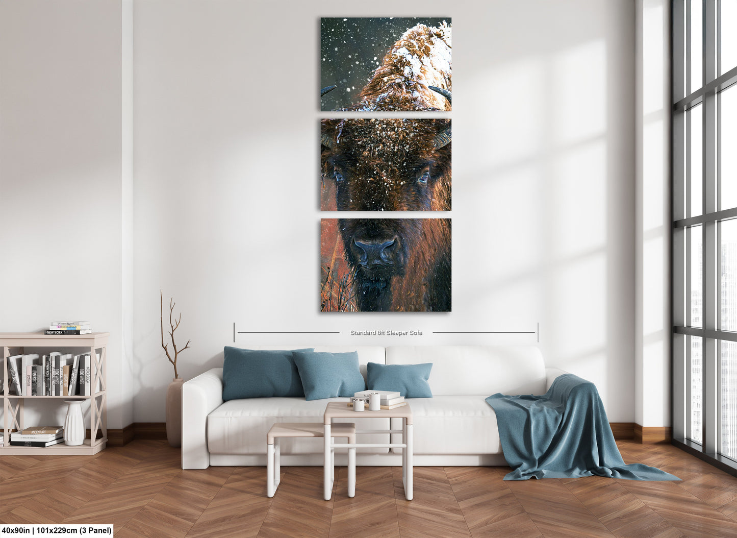 a living room with a white couch and three paintings on the wall