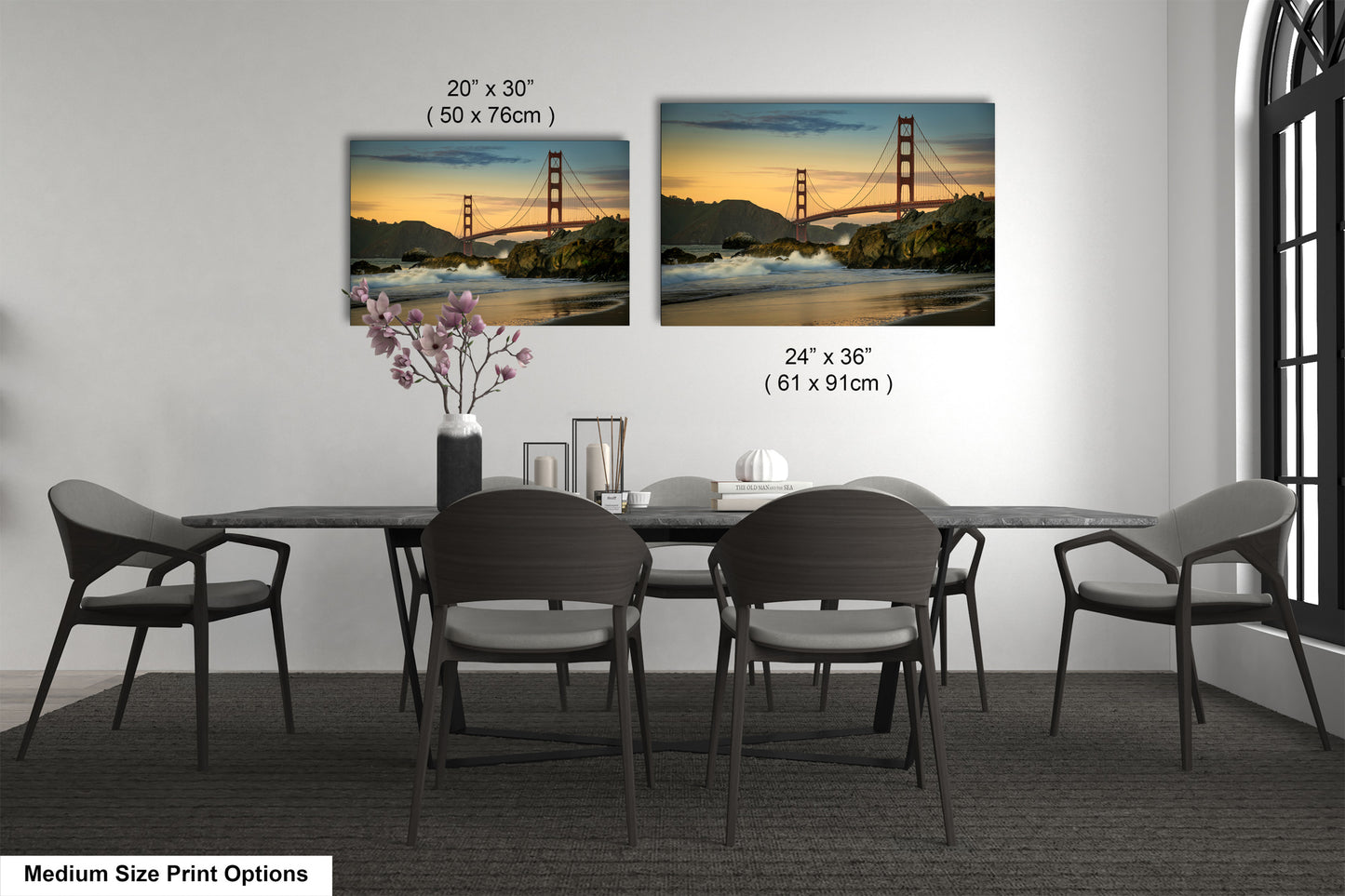 a dining room table with four chairs and a vase of flowers
