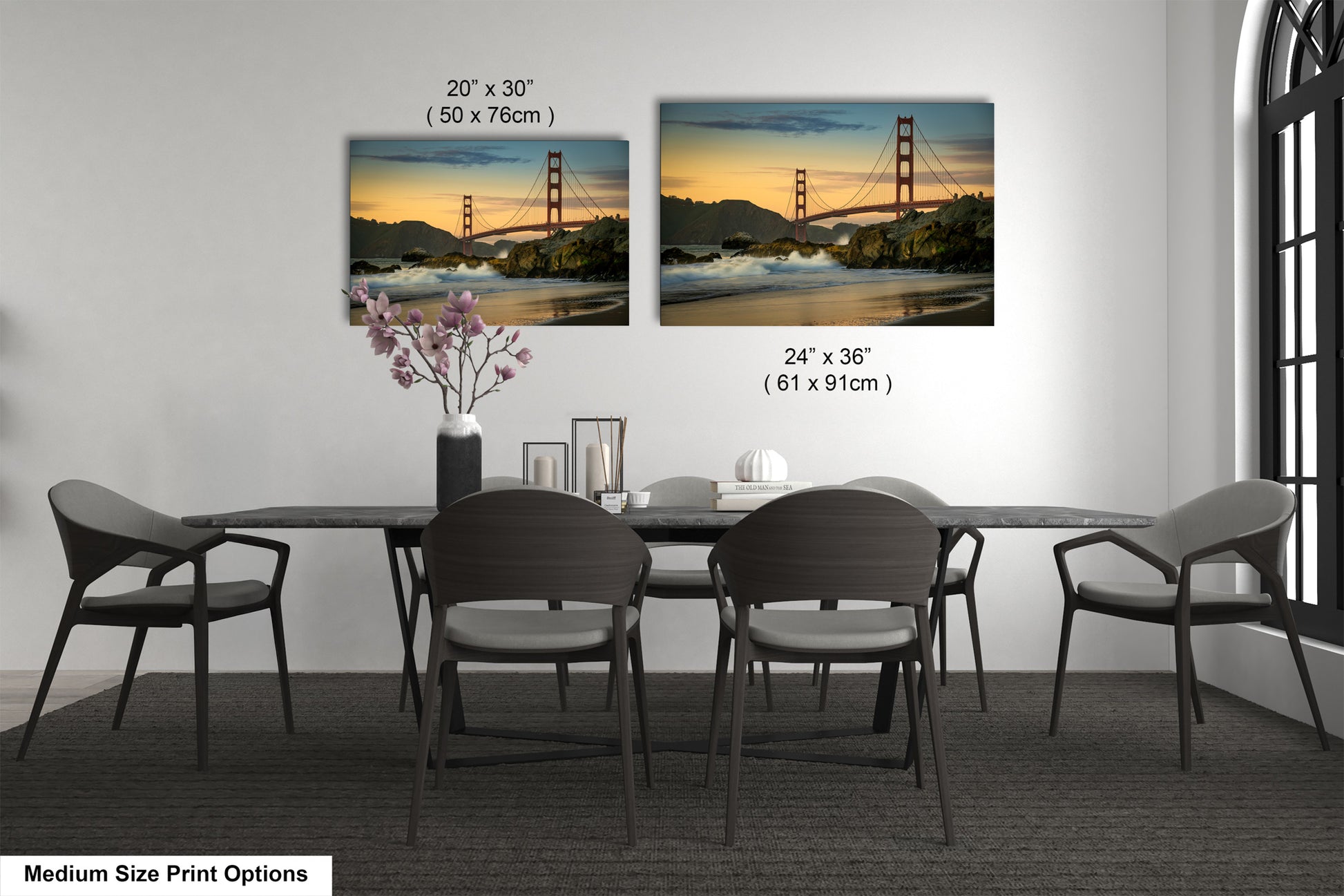 a dining room table with four chairs and a vase of flowers
