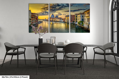 a dining room table with chairs and a painting on the wall