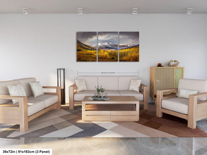 a living room filled with furniture and a painting on the wall