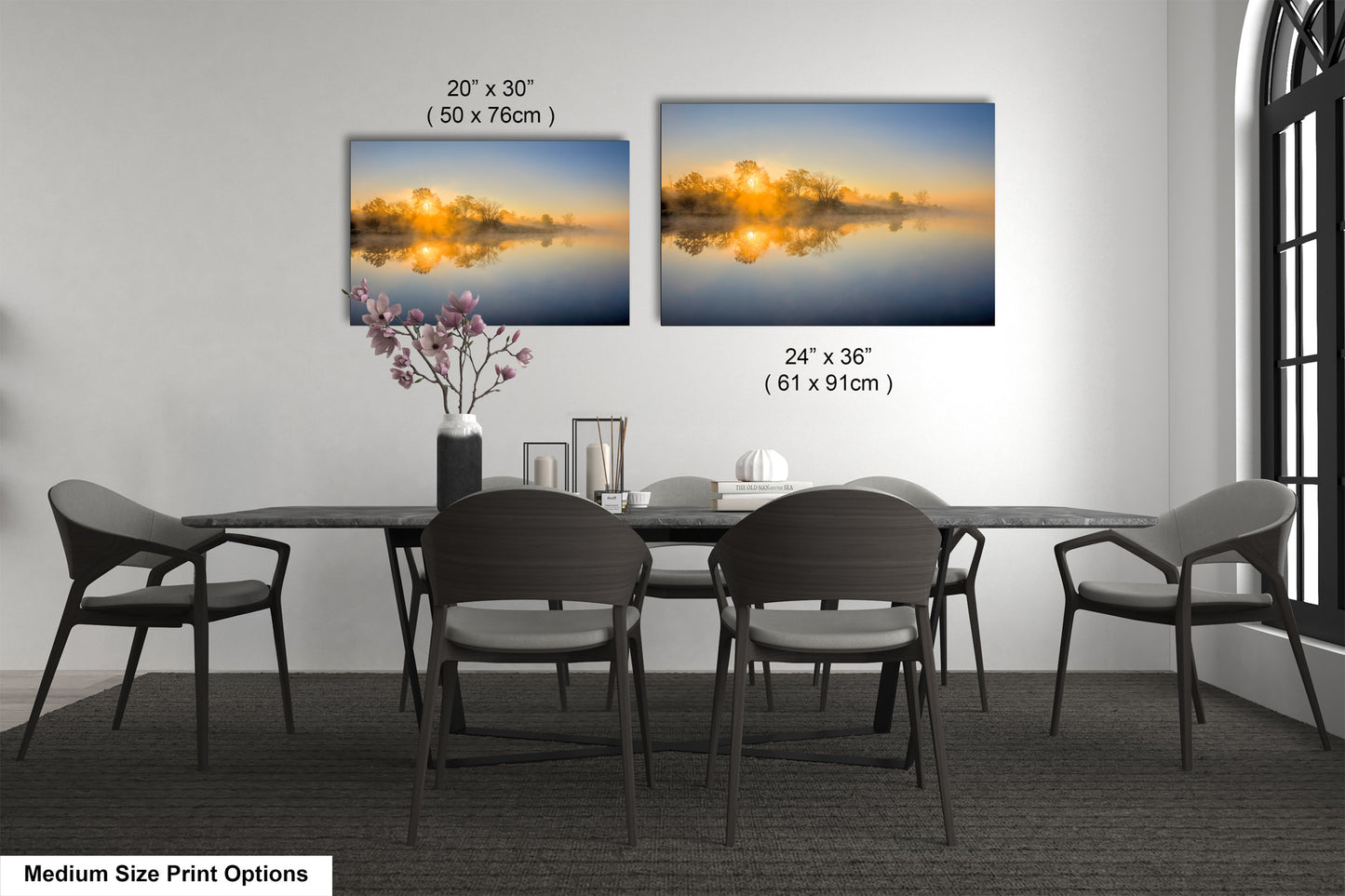 a dining table with four chairs and a vase with flowers