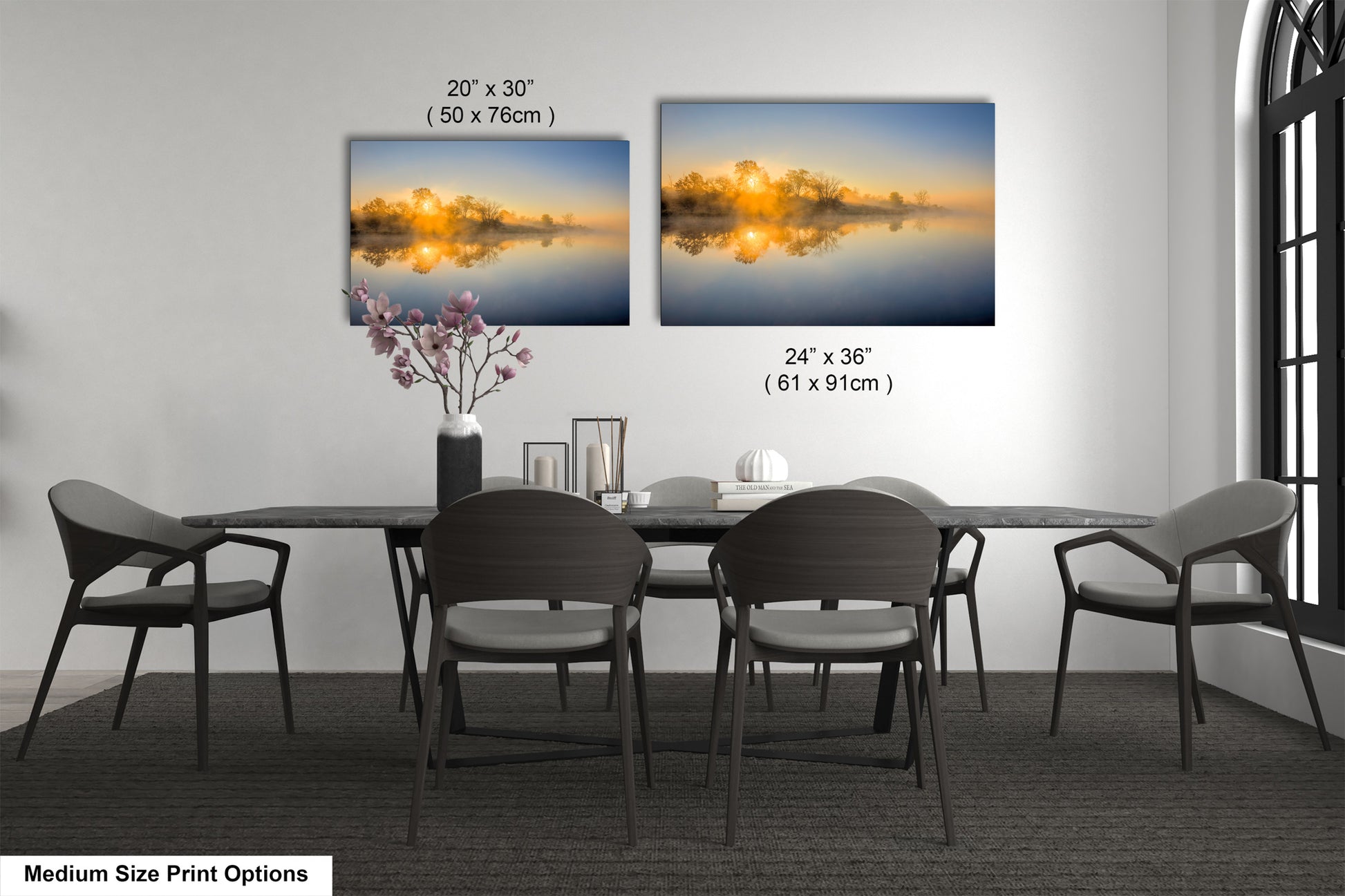 a dining table with four chairs and a vase with flowers