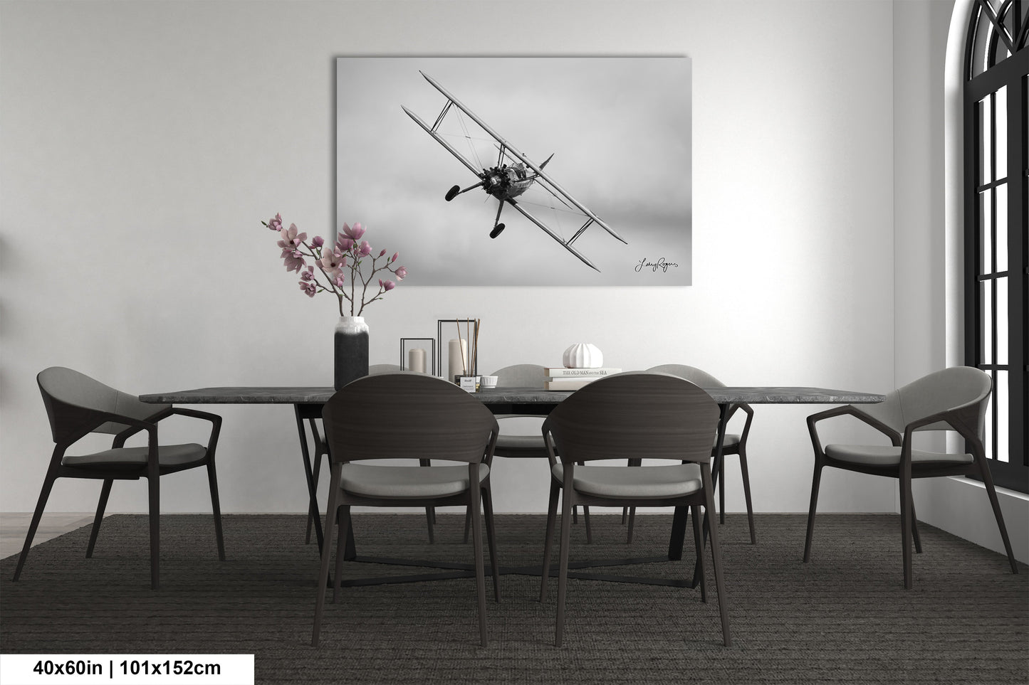 a black and white photo of a dining room table