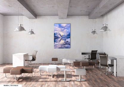 a room with a lot of chairs and a painting on the wall