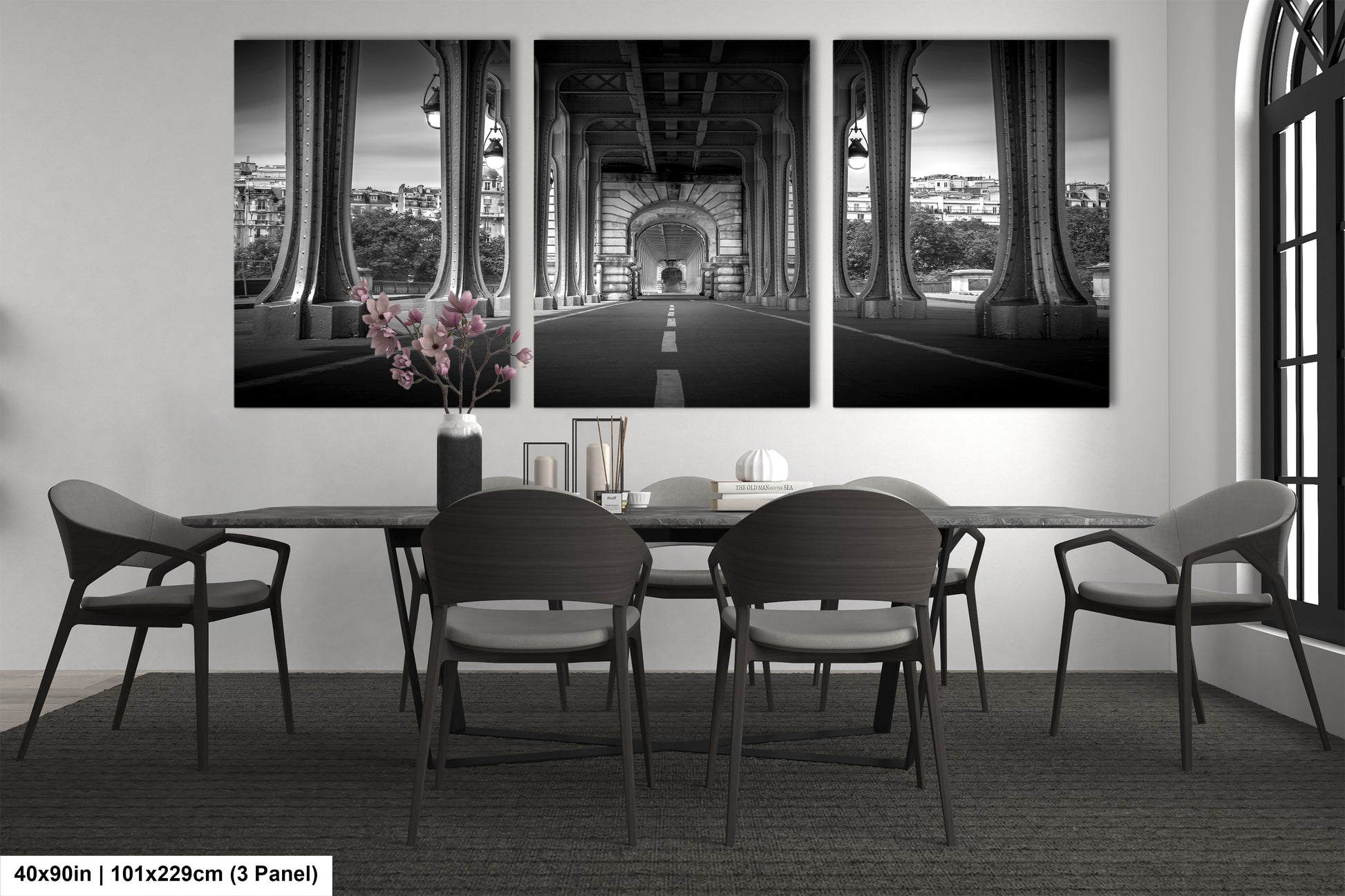 a black and white photo of a dining room