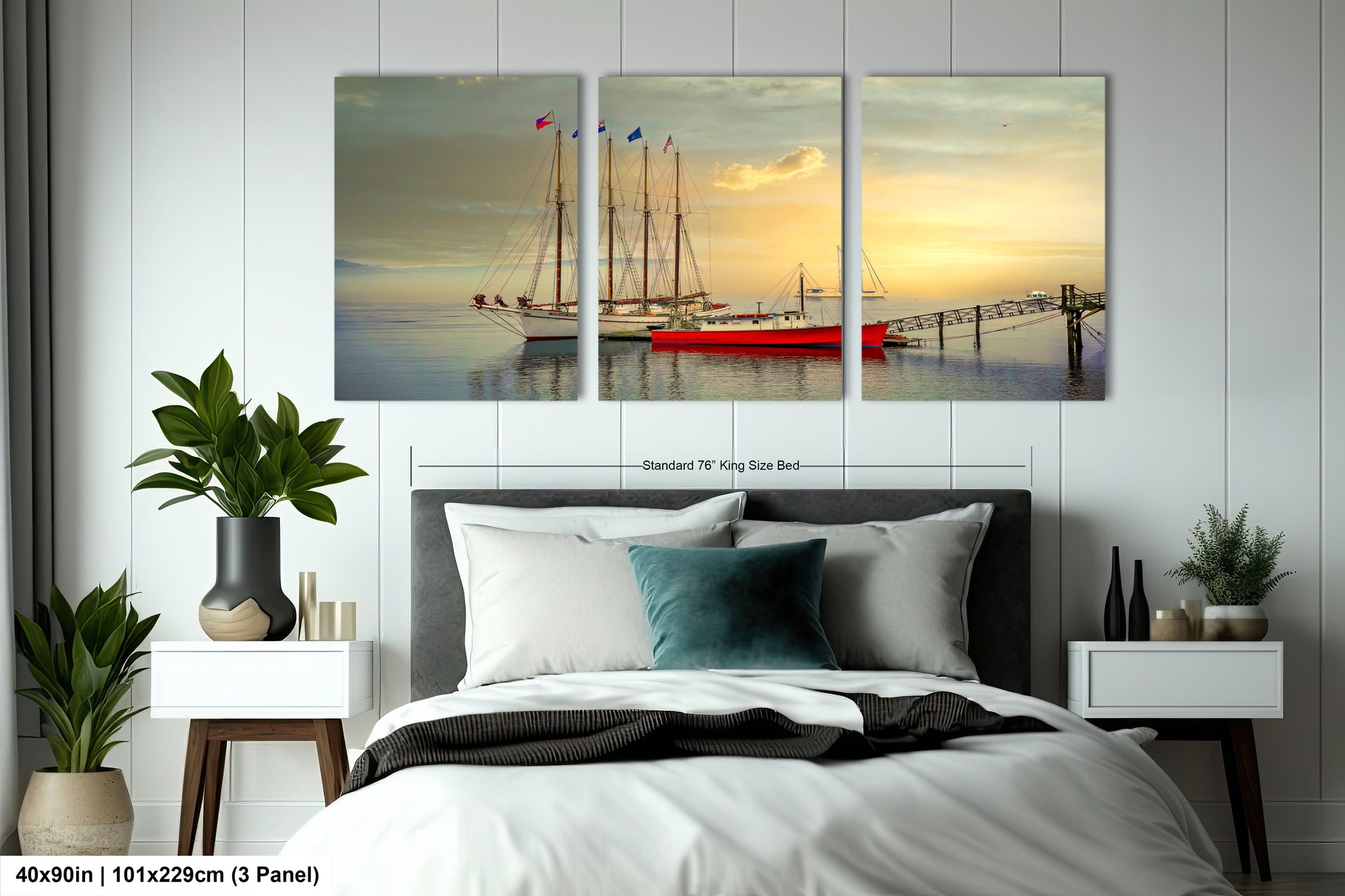 a bedroom with a bed and two paintings on the wall