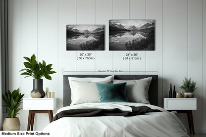 a bedroom with a bed, nightstands, and two pictures on the wall