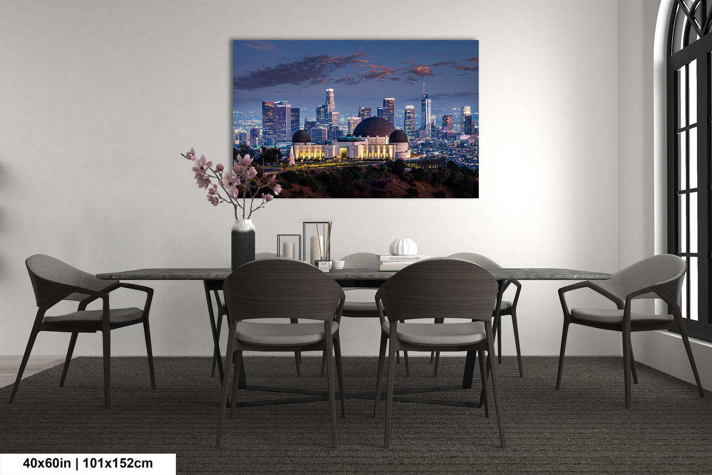 a dining room table with a view of a city