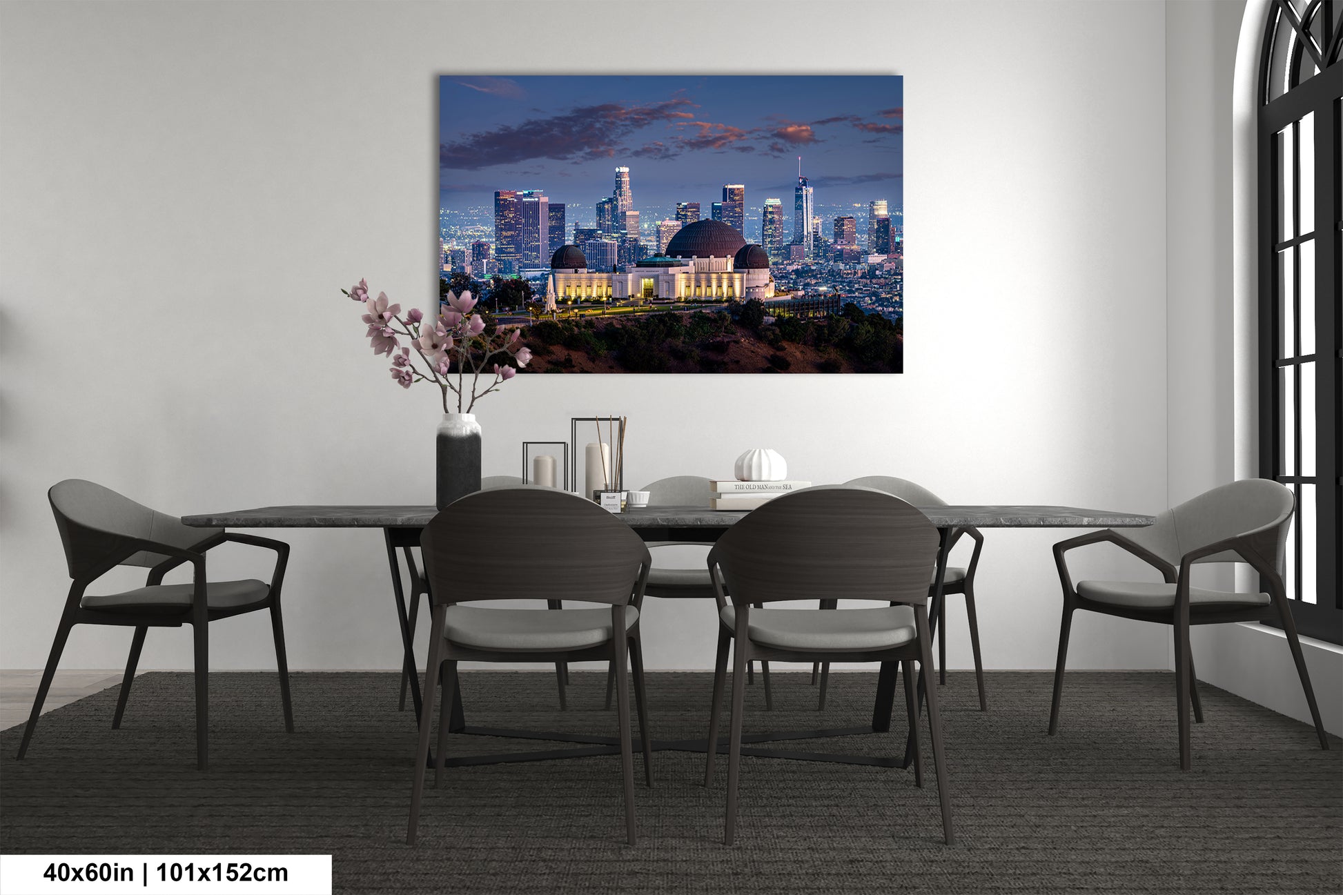 a dining room table with a view of a city