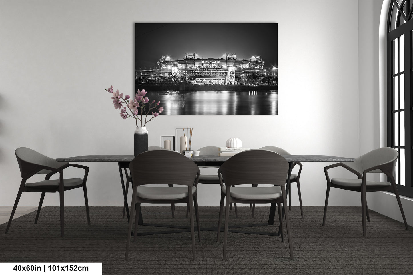 a black and white photo of a dining room table