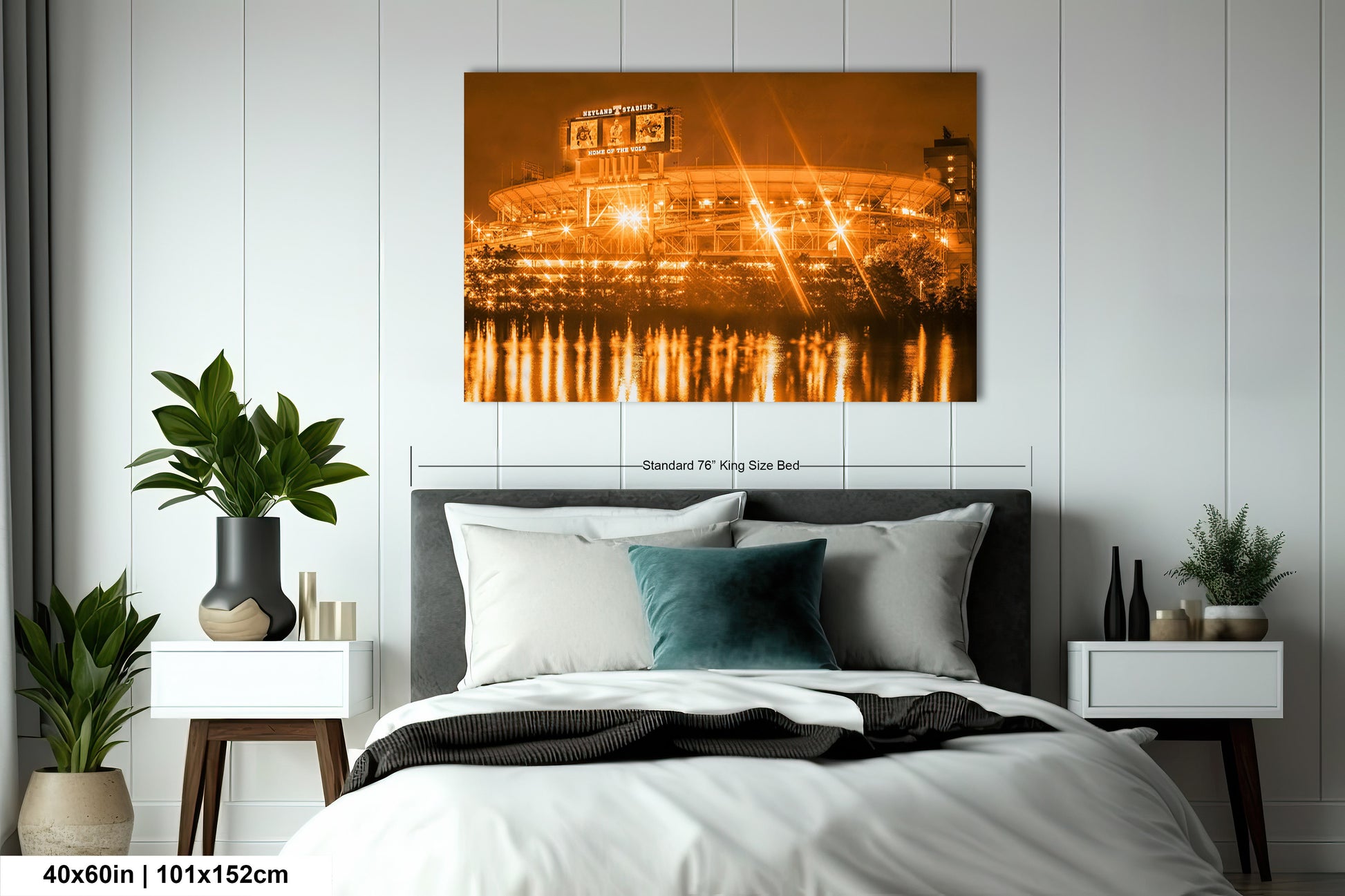 a bed room with a neatly made bed and a painting on the wall