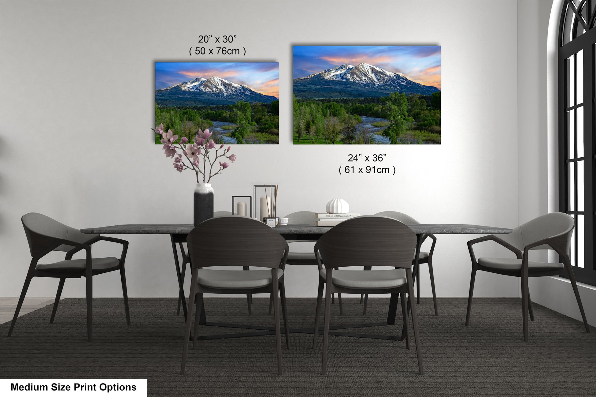 a dining room table with chairs and a vase with flowers