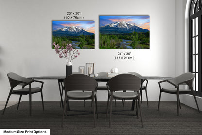 a dining room table with chairs and a vase with flowers
